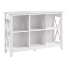 a white bookcase with four shelves on each side