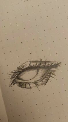 a drawing of an eye on a piece of paper with dots around it and a bird flying overhead