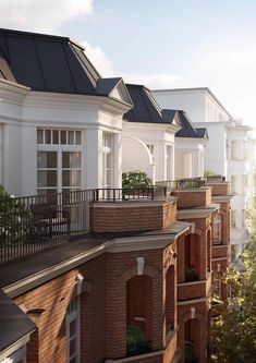 an artist's rendering of a row of houses with balconies and windows