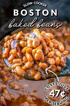 a spoon full of baked beans with the words slow cooker baked beans