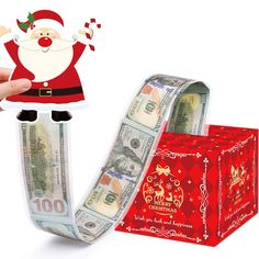 a santa clause holding money in front of a red box