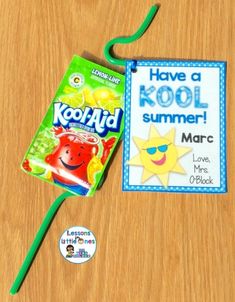 a book and a green toothbrush sitting on a table next to a kool - aid stick