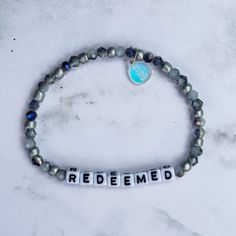 a beaded bracelet with the word'ridemed'written on it