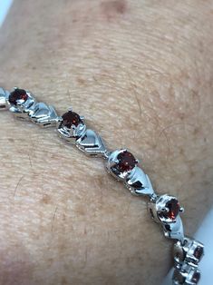 Vintage Bohemian Red Garnet Bracelet 925 Sterling Silver
https://www.etsy.com/listing/661914121/vintage-bohemian-red-garnet-bracelet-925 Polished Tennis Bracelet For Gifts, Red Sterling Silver Anniversary Bracelet, Red Sterling Silver Jubilee Bracelet, Formal Silver Garnet Bracelets, Red Sterling Silver Bracelet For Formal Occasions, Red Bracelet With Polished Finish As Gift, Red Bracelet With Polished Finish For Gift, Sterling Silver Gemstone Tennis Bracelet Gift, Red Polished Finish Bracelet For Gift