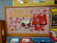 a bunch of sweethearts bulletin board on the wall in front of a classroom desk