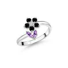 a white gold ring with black and purple stones