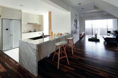 the kitchen is clean and ready to be used as a living room or dining area