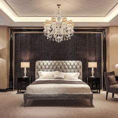 a bedroom with a chandelier hanging from the ceiling and a large bed in front of it