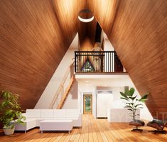 a living room with wooden floors and white furniture in the middle of an open floor plan