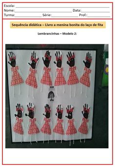 a bulletin board with handprints on it and spanish words in the middle one