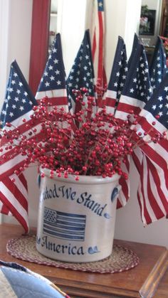 an american flag arrangement in a bucket on a table