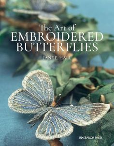 the art of embroideded butterflies by jane e hall, with an image of a butterfly sitting on top of leaves