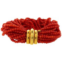 Lovely bracelet created by Verdura in the 2000s. The bracelet is made of coral bead strands finished with an 18 karat (stamped) yellow gold clasp. The bracelet measures 7-3/4 x 1-1/4 inches (19.5 x 3.5 centimeters) and fits up to 6-1/4-inch (16-centimeters) wrist. The bracelet weighs 112.8 grams. The clasp is stamped with Verdura maker's mark and hallmark for 18 karat gold. The bracelet comes in an original Verdura box which makes it a perfect gift at the fraction of the retail price! Yellow Gold Cuff Bracelet, Bead Cuff Bracelet, Pearl Cuff Bracelet, Pearl Strands Necklace, Pearl Cuff, Diana Vreeland, Ruby Bracelet, Beaded Cuff Bracelet, Multi Strand Bracelet