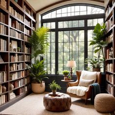 a living room filled with lots of books and furniture next to a large window covered in plants