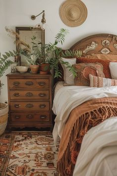 a bed room with a neatly made bed next to a dresser and potted plants