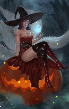 a woman dressed as a witch sitting on top of a pumpkin