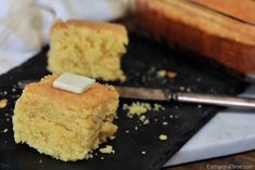 two pieces of cake sitting on top of a black plate