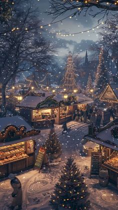 a christmas village with lots of trees and lights in the snow at night, as well as people walking around