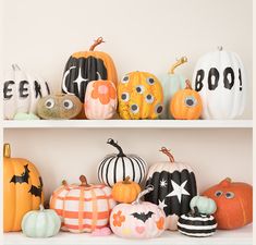 several pumpkins are sitting on shelves with eyes painted on them