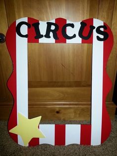 a wooden frame with the word circus painted on it and a star next to it