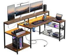 three computer desks with monitors and keyboards on top of each one, all in different positions