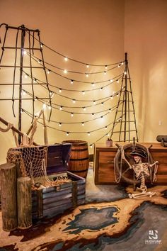 a room decorated with pirate decorations and string lights