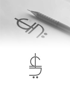 a pen is sitting on top of a piece of paper with the letter d in it