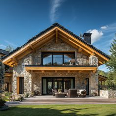 a large stone house with wood trimming