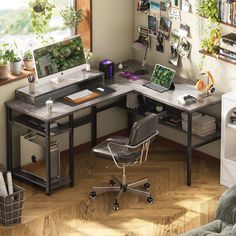 a corner desk with a computer on it in front of a window filled with potted plants