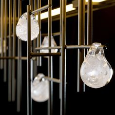 some glass balls hanging from a metal rack