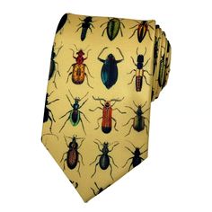 Crafted with meticulous attention to detail, this charming accessory features a delightful array of vibrantly hued insects intricately woven into a luxurious gold background. Whether you're adding a playful twist to your formal attire or looking to make a statement at a special event, this exquisitely designed tie is sure to capture attention and spark conversation. Made from premium materials, it offers both style and durability, ensuring you stand out from the crowd with timeless elegance and Funky Ties, Bug Fashion, Mens Evening Wear, Silly Clothes, Fun Tie, Funky Outfits, Cool Ties, Gold Background, Friends Are Like