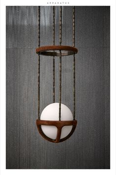 a white and brown object hanging from strings