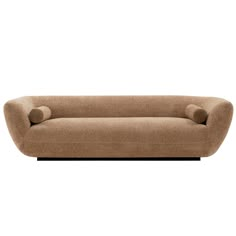 a brown couch sitting on top of a white floor