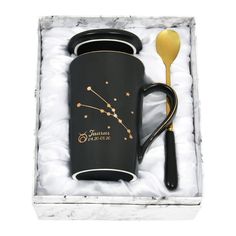 a black coffee cup and spoon in a gift box