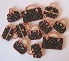 twelve louis vuitton purses decorated cookies in the shape of handbags and purses