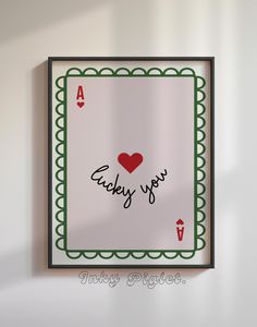 a playing card with the words lucky you written on it and a red heart in the middle