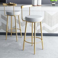 two stools in front of a kitchen counter