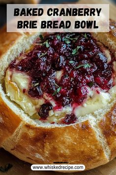 baked cranberry brie bread bowl on a cutting board with text overlay