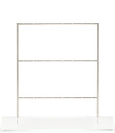 a white metal shelf with two shelves on each side and one in the middle, against a white background