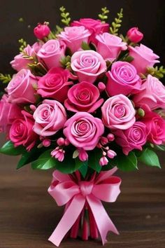 a bouquet of pink roses in a vase