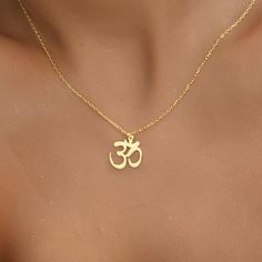 14K Gold Plated Om Necklace, Gift for Her, Spiritual Gift, Yoga Necklace, Christmas Gifts, Dainty Necklace, Symbol Necklace, Gift for Mom - OM NECKLACE - We create dainty, unique, and personalized jewelry perfect for any occasion, from Christmas gifts and birthdays to Mother's Day, anniversaries, and bridesmaid gifts. Explore our collection to find the ideal piece for celebrating life's special moments. OTHER FEATURES * High-Quality Materials: Crafted from 925 Silver, not stainless steel. * Color Options: Offered in Gold, Rose Gold, and White Gold. * Eco-Friendly and Hypoallergenic: Nickel-free, tarnish-resistant, and made with eco-friendly materials. * Packaging: Comes in a lovely jewelry box, perfect for gifting. * Customer Support: We're here to assist with any product issues or inquiri Spiritual Gold Charm Necklaces For Valentine's Day, Gold Spiritual Charm Necklaces For Valentine's Day, Gold Spiritual Charm Necklace For Valentine's Day, Spiritual Jewelry For Christmas Gift, Gold Spiritual Necklace For Gifts, Spiritual Gold Necklace Gift, Spiritual Cadmium-free Charm Necklace As Gift, Hindu Jewelry, Om Necklace