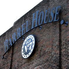 a brick building with a sign on it that says barrel house