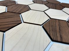 a close up view of some wood pieces on the floor with white and brown colors