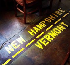 there are two signs on the floor that say new hampshire and new vermont