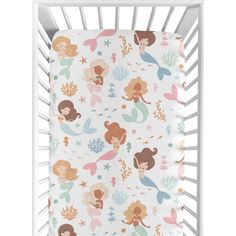 a white crib with mermaids and stars on it