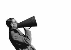 black and white photograph of a man with a megaphone