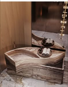 a bathroom sink made out of wood and marble