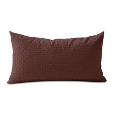 a brown pillow on a white background