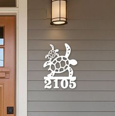 a door with a light on it and a turtle decal