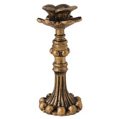 a gold colored candle holder with balls on it's sides and an ornate design